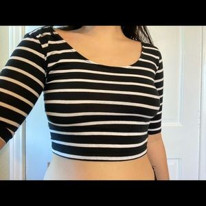 A black and white striped crop top .